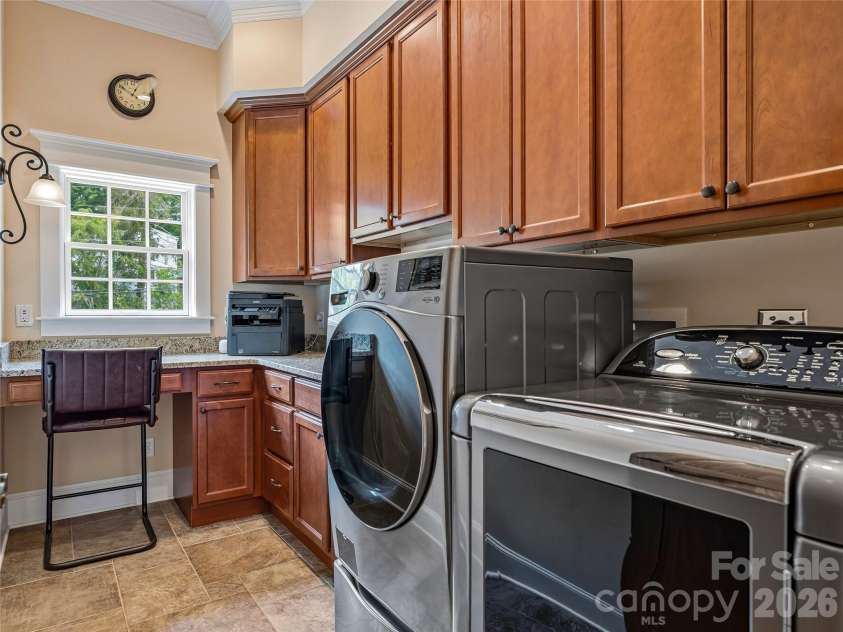 76 Edgelawn Road, Asheville, NC 28804.  MLS# CAR4391400, YatesRealty ID 32775. Convenient Laundry on Main with Workspace and Storage
