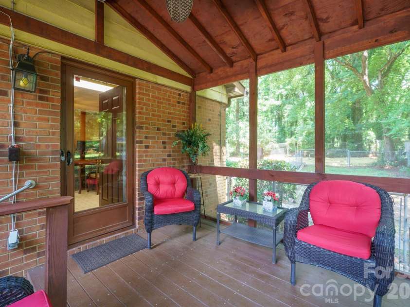 1505 Kingston Drive, Kannapolis, NC 28083.  MLS# CAR4393670, YatesRealty ID 32779. Screened side sunporch overlooking front and backyard