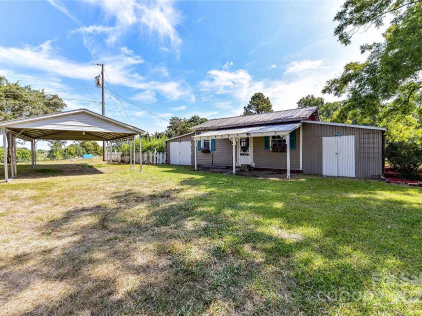 1021 Cyrus Edwards Road, Monroe, NC 28110.  MLS# CAR4314591, YatesRealty ID 32783. Secondary living space and detached 2-car carport
