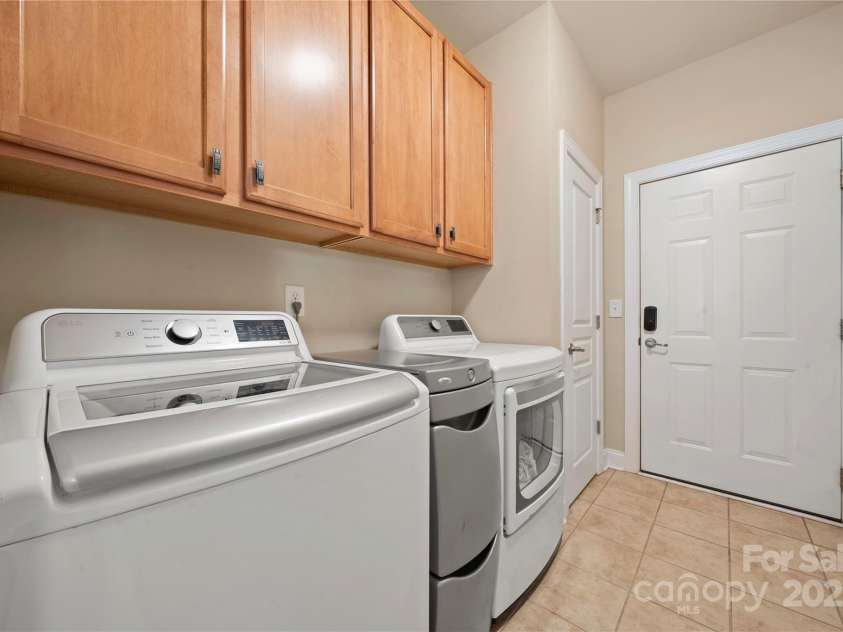 1103 Phar Lap Drive, Indian Trail, NC 28079.  MLS# CAR4273621, YatesRealty ID 32786. Main floor laundry with cabinetry