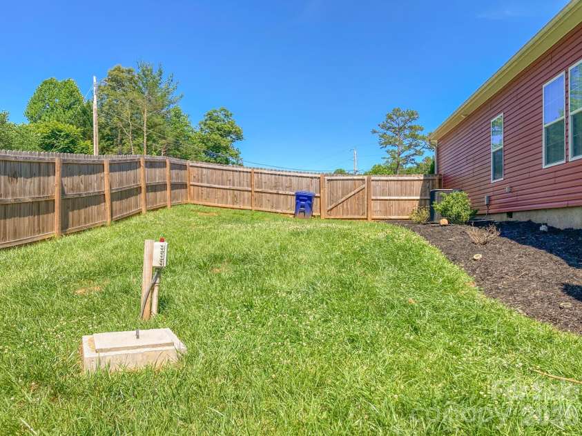 2 Clarks Chapel Extension, Weaverville, NC 28787.  MLS# CAR4393203, YatesRealty ID 32786. Back Yard with Pump Septic