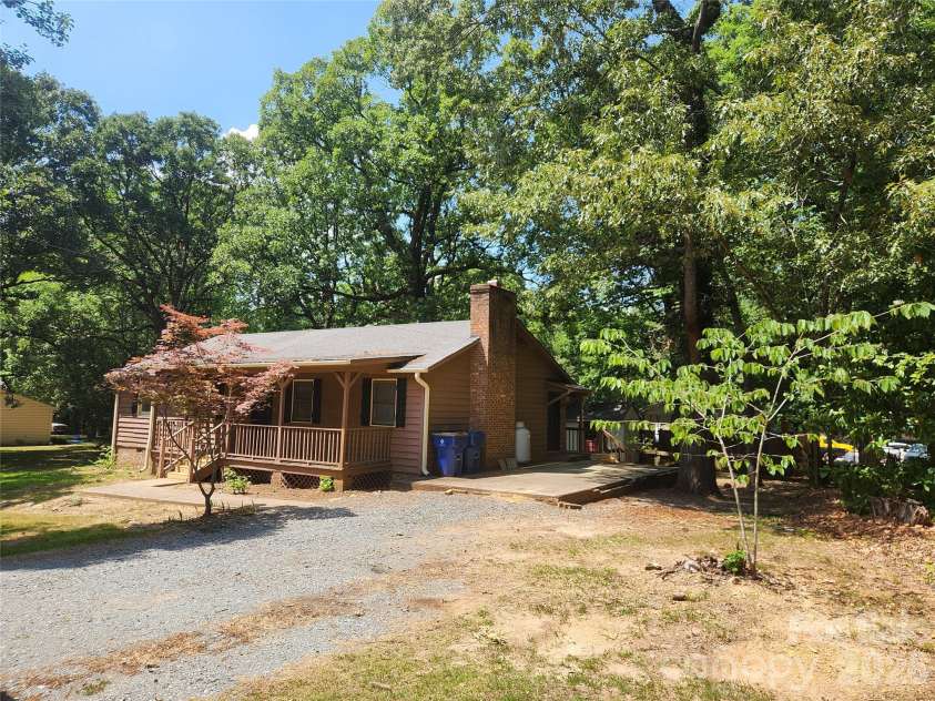 106 Maye Street, Wingate, NC 28174.  MLS# CAR4395338, YatesRealty ID 32788. Front right view with driveway/cement pad