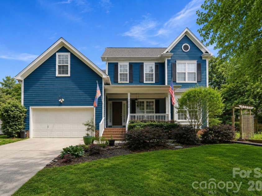 7702 Spanish Oaks Drive, Waxhaw, NC 28173.  MLS# CAR4429062, YatesRealty ID 32796. Ai-edited image to remove beautiful tree in front of home for better visibility.