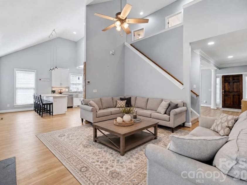 7702 Spanish Oaks Drive, Waxhaw, NC 28173.  MLS# CAR4429062, YatesRealty ID 32796. Gorgeous living with virtually staged rug and coffee table