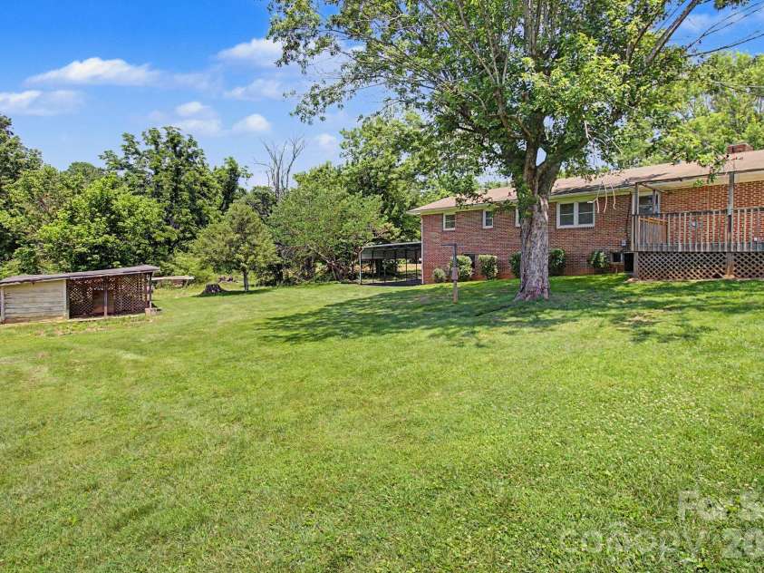 12 Webster Street, Weaverville, NC 28787.  MLS# CAR4389856, YatesRealty ID 32797. Large back yard