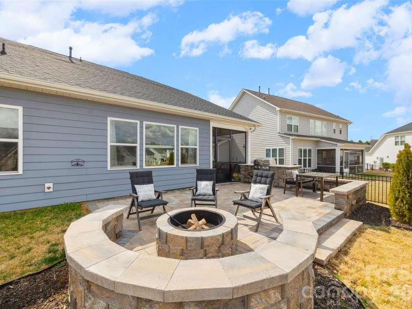 7004 Kingfisher Way, Belmont, NC 28012.  MLS# CAR4353741, YatesRealty ID 3281. Custom paver firepit for cool evenings