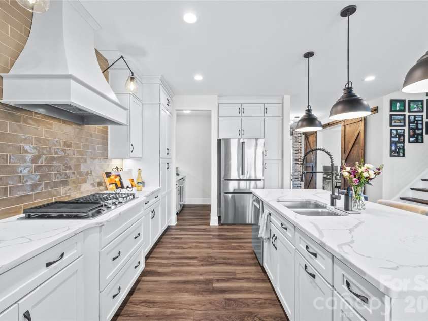 7004 Kingfisher Way, Belmont, NC 28012.  MLS# CAR4353741, YatesRealty ID 3281. View towards butler pantry