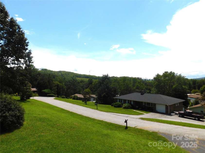 125 Fulton Drive, Hendersonville, NC 28792.  MLS# CAR4292977, YatesRealty ID 32820. Porch View