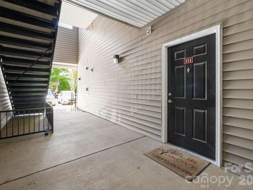 111 Appeldoorn Circle, Asheville, NC 28803.  MLS# CAR4397274, YatesRealty ID 32823. Condo front door with easy access to parking