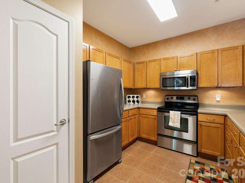 111 Appeldoorn Circle, Asheville, NC 28803.  MLS# CAR4397274, YatesRealty ID 32823. Kitchen and pantry