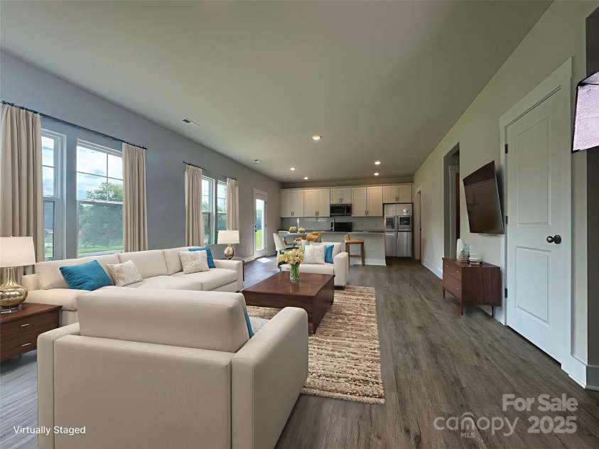 107 Silverwood Court, Mooresville, NC 28115.  MLS# CAR4279215, YatesRealty ID 32827. Living area to kitchen Virtually staged