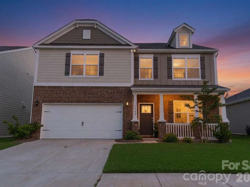 1200 Secrest Commons Drive, Monroe, NC 28112.  MLS# CAR4397398, YatesRealty ID 32828. Vr twilight