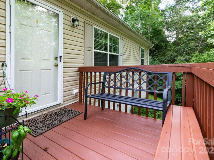 100 Susanna Cove Road, Mars Hill, NC 28754.  MLS# CAR4288018, YatesRealty ID 32835. Front porch for watching birds and drinking coffee