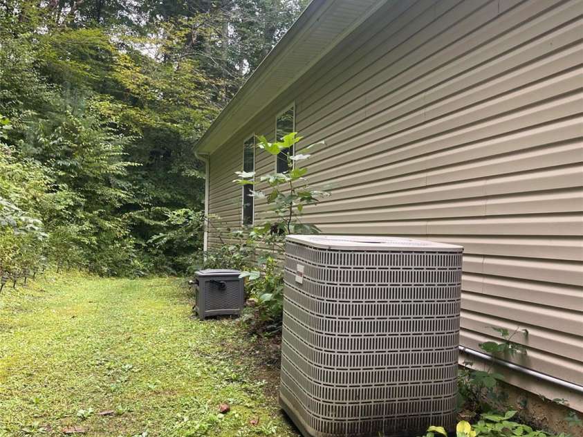 100 Susanna Cove Road, Mars Hill, NC 28754.  MLS# CAR4288018, YatesRealty ID 32835. HVAC on the back of home