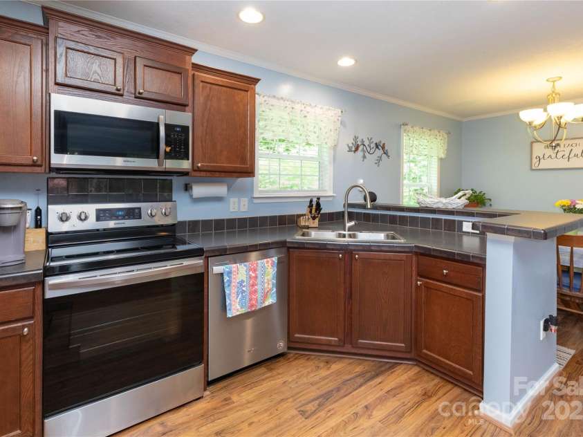 100 Susanna Cove Road, Mars Hill, NC 28754.  MLS# CAR4288018, YatesRealty ID 32835. Kitchen with new stainless steel appliances