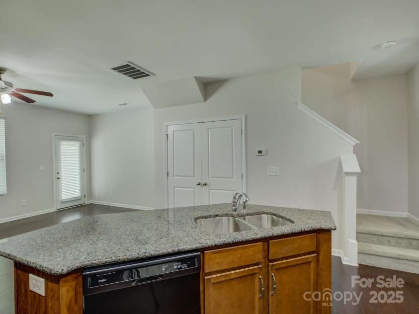1916 Aston Mill Place, Charlotte, NC 28273.  MLS# CAR4278175, YatesRealty ID 32838. Kitchen island opens to great room