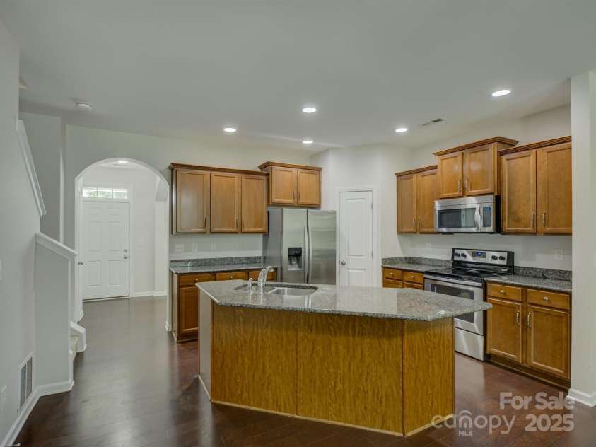1916 Aston Mill Place, Charlotte, NC 28273.  MLS# CAR4278175, YatesRealty ID 32838. Kitchen with large island, pantry and plenty of storage