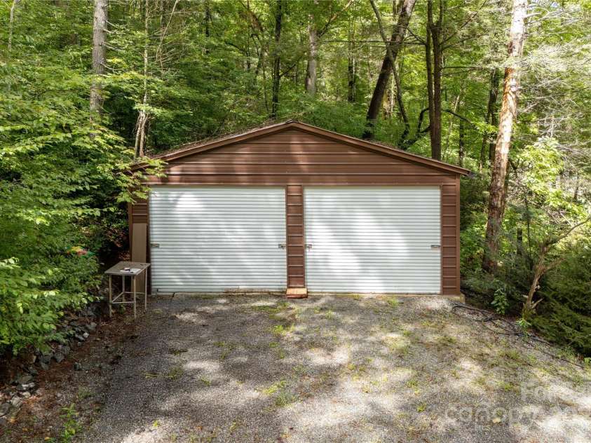 458 Rio Verde Drive, Zirconia, NC 28790.  MLS# CAR4289067, YatesRealty ID 32844. Separate 2 car garage--slab floor and loads of storage