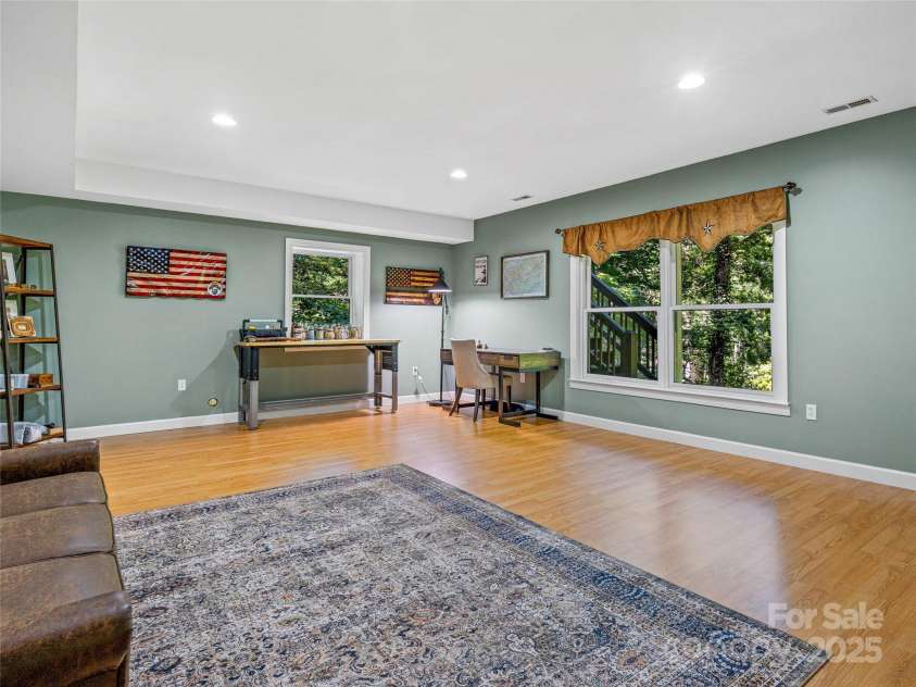 247 Big Raven Lane, Saluda, NC 28773.  MLS# CAR4272997, YatesRealty ID 32851. Lower level bedroom with walk in closet 