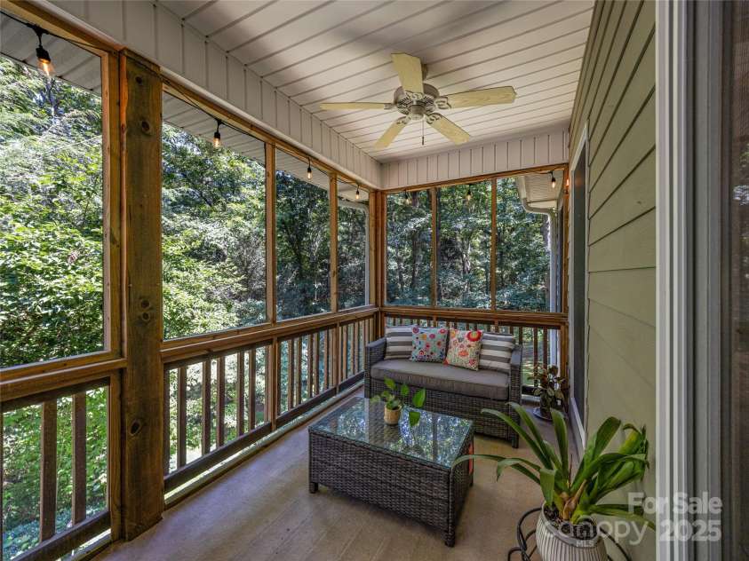 247 Big Raven Lane, Saluda, NC 28773.  MLS# CAR4272997, YatesRealty ID 32851. Screened in porch