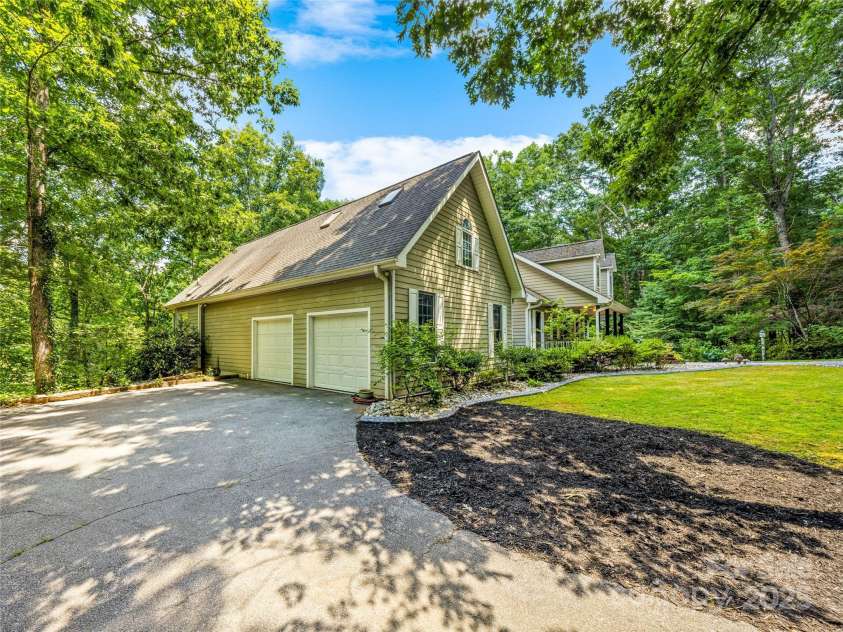 247 Big Raven Lane, Saluda, NC 28773.  MLS# CAR4272997, YatesRealty ID 32851. Two car main level garage