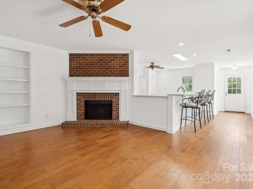 2234 Hamilton Mill Road, Charlotte, NC 28270.  MLS# CAR4261360, YatesRealty ID 32855. AI generated empty den painted white