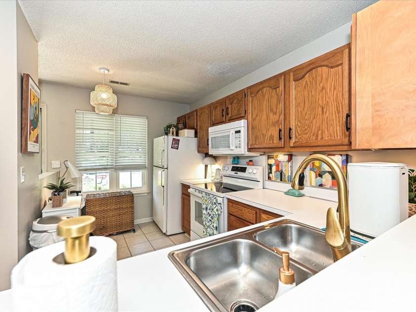 9305 Four Mile Creek Road, Charlotte, NC 28277.  MLS# CAR4244964, YatesRealty ID 32863. Brushed Brass faucet provides a contemporary update