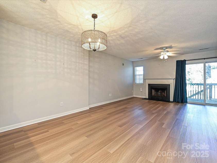 9305 Four Mile Creek Road, Charlotte, NC 28277.  MLS# CAR4332192, YatesRealty ID 32863. Living Room with Fireplace