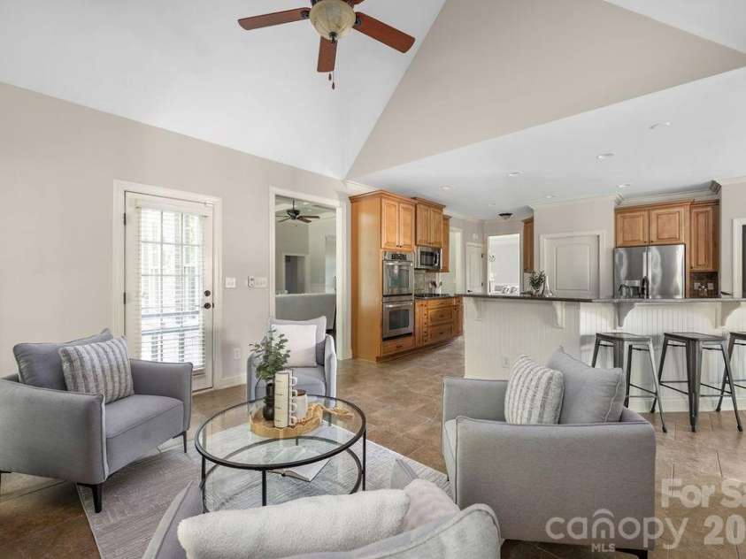 8325 Curico Lane, Charlotte, NC 28227.  MLS# CAR4387517, YatesRealty ID 32877. Additional seating at the Kitchen Bar