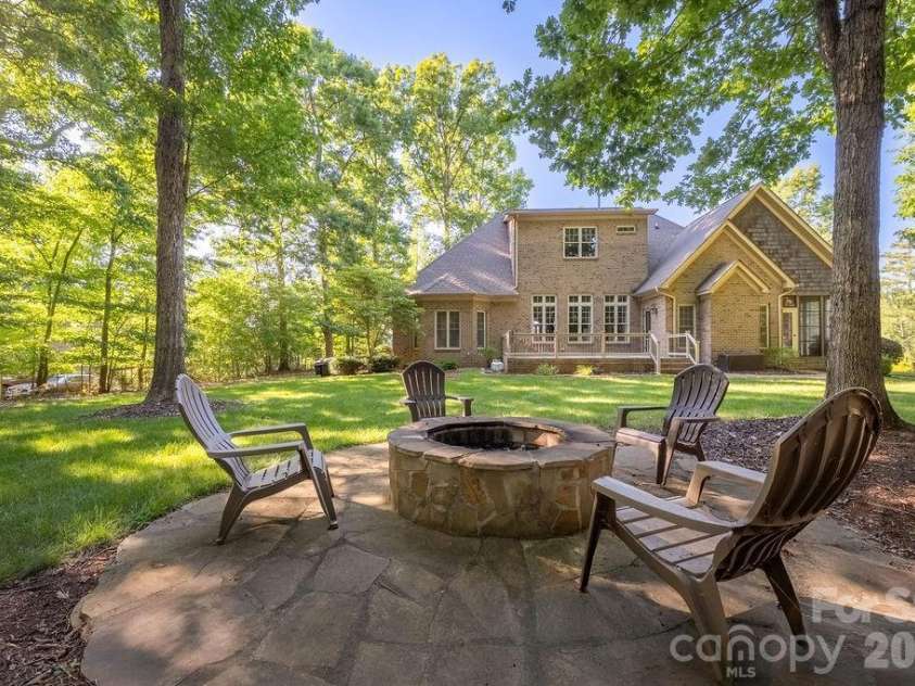 8325 Curico Lane, Charlotte, NC 28227.  MLS# CAR4387517, YatesRealty ID 32877. Built in Stone Paved Firepit