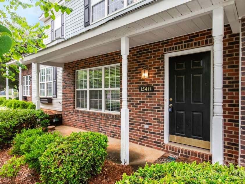 15411 Asterwind Court, Charlotte, NC 28277.  MLS# CAR4390329, YatesRealty ID 32878. A welcoming front porch sets the perfect tone for this beautiful townhouse, offering a charming spot to step outside and greet the day.