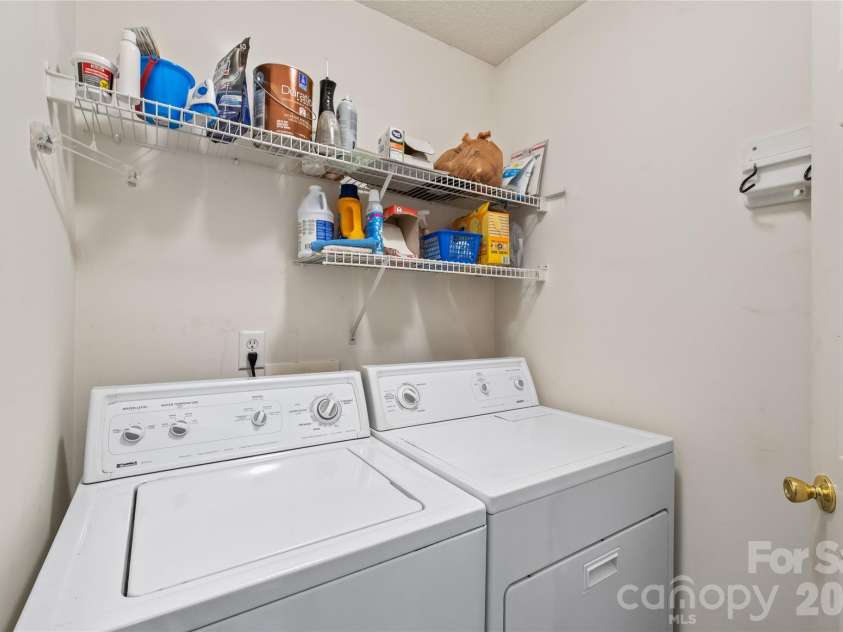 15411 Asterwind Court, Charlotte, NC 28277.  MLS# CAR4390329, YatesRealty ID 32878. Dedicated laundry room offering convenient main-level access and plenty of space for organization.