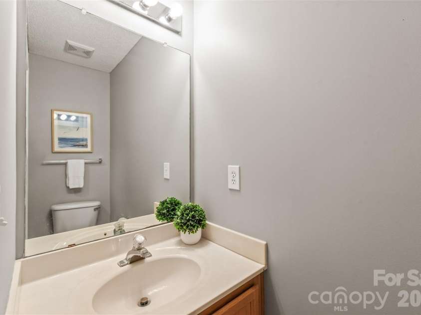15411 Asterwind Court, Charlotte, NC 28277.  MLS# CAR4390329, YatesRealty ID 32878. Powder Bathroom on the main level offers effortless convenience for your guests while keeping your upstairs bedrooms completely private.