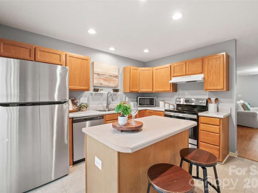 15411 Asterwind Court, Charlotte, NC 28277.  MLS# CAR4390329, YatesRealty ID 32878. Sleek, updated stainless steel appliances...including the refrigerator that stays with the home...bring a modern, move-in-ready touch to the kitchen.