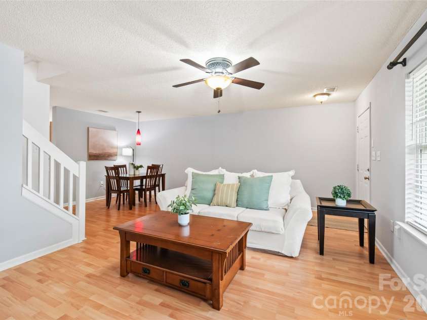 15411 Asterwind Court, Charlotte, NC 28277.  MLS# CAR4390329, YatesRealty ID 32878. The bright, open-concept layout seamlessly connects your living and dining spaces, creating an airy and inviting atmosphere perfect for both relaxing and entertaining.