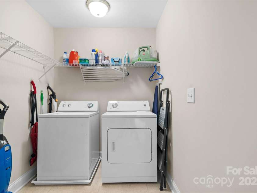 19333 Pocono Lane, Cornelius, NC 28031.  MLS# CAR4286537, YatesRealty ID 32878. An unexpected surprise - a massive laundry room! There is plenty of room if you want to add a lot more storage (washer and dryer not included).