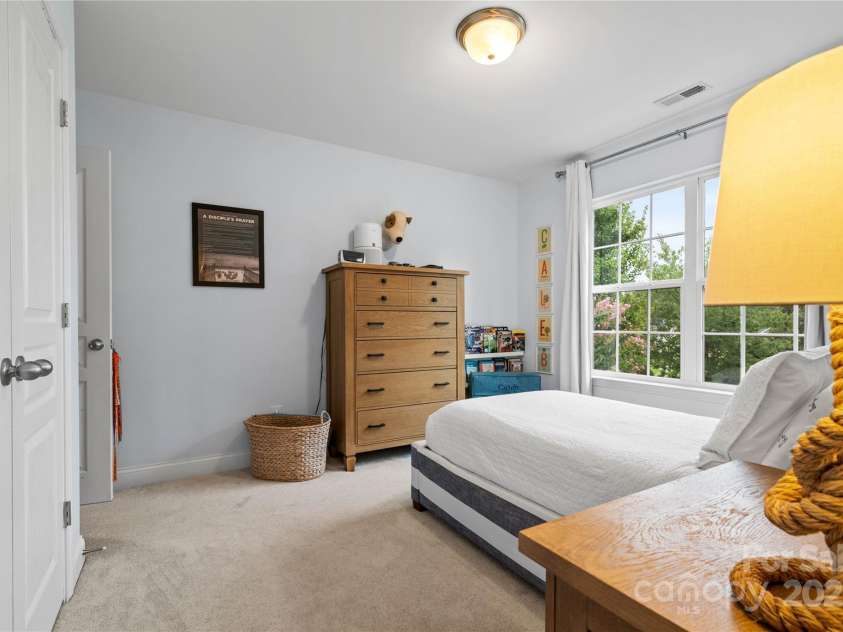 19333 Pocono Lane, Cornelius, NC 28031.  MLS# CAR4286537, YatesRealty ID 32878. Bedroom 2 looking from the bathroom. There is also a closet system behind the closet doors.