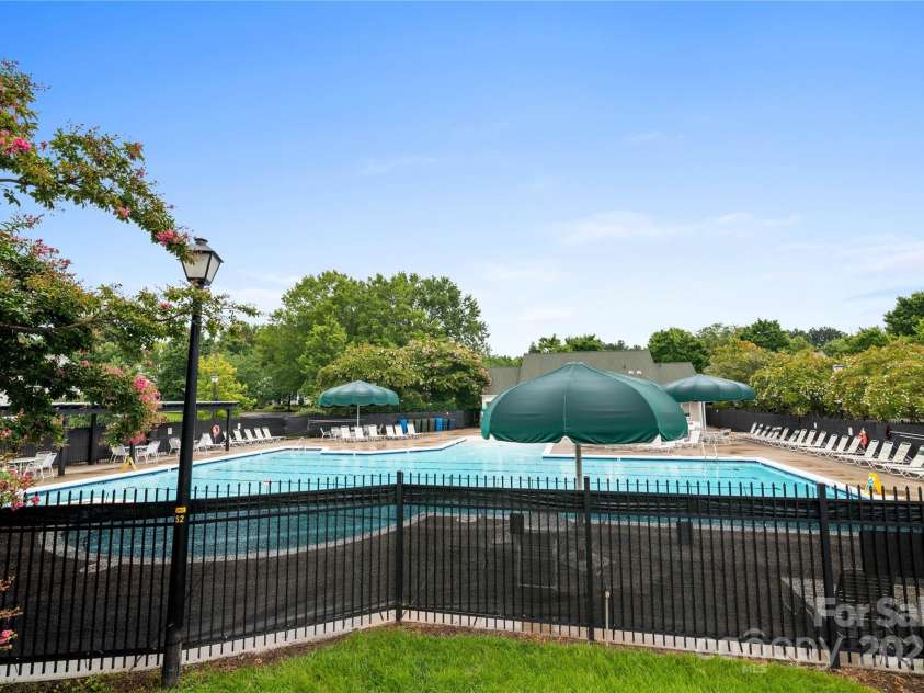 19333 Pocono Lane, Cornelius, NC 28031.  MLS# CAR4286537, YatesRealty ID 32878. Community pool with brand new privacy screen!