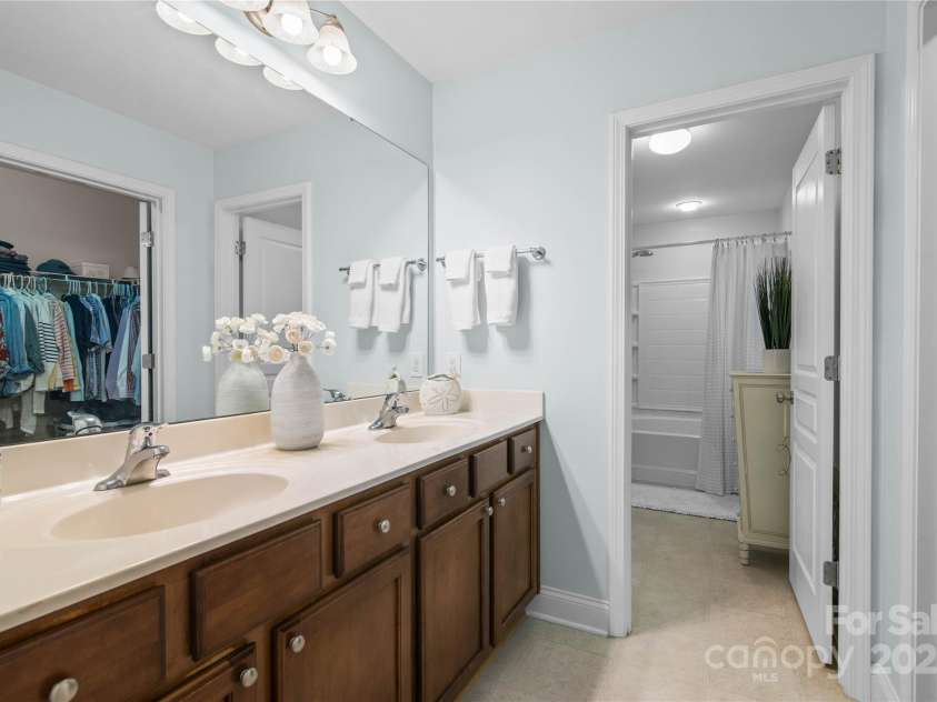 19333 Pocono Lane, Cornelius, NC 28031.  MLS# CAR4286537, YatesRealty ID 32878. Huge primary bathroom with double sinks and massive walk in closet - very unexpected for the square footage.