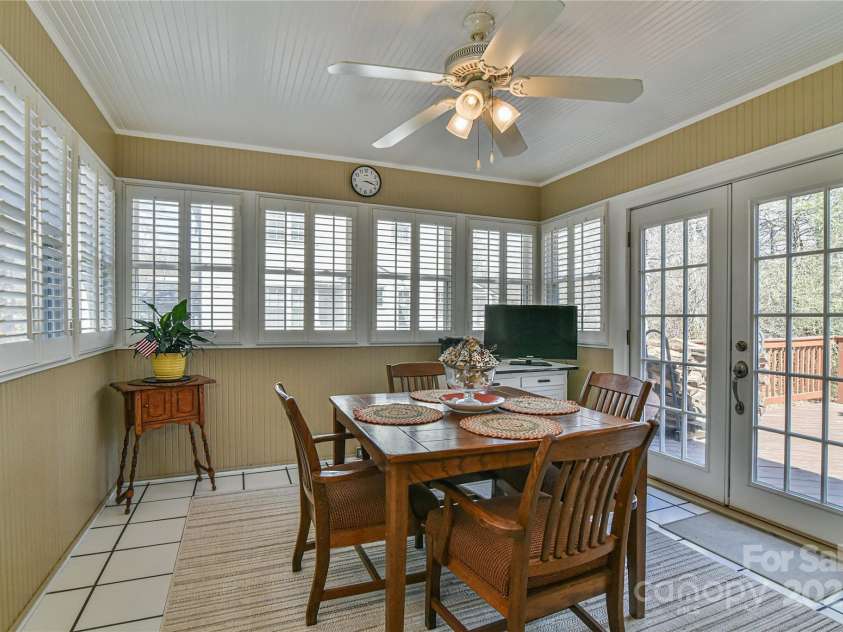 302 Montreat Road, Black Mountain, NC 28711.  MLS# CAR4234971, YatesRealty ID 3288. Bright and Cheery Dining Room Opens to Back Deck
