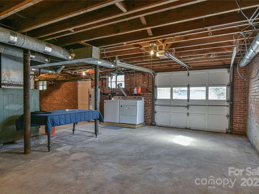 302 Montreat Road, Black Mountain, NC 28711.  MLS# CAR4234971, YatesRealty ID 3288. Single Car Garage Plus Large Storage Area in Basement