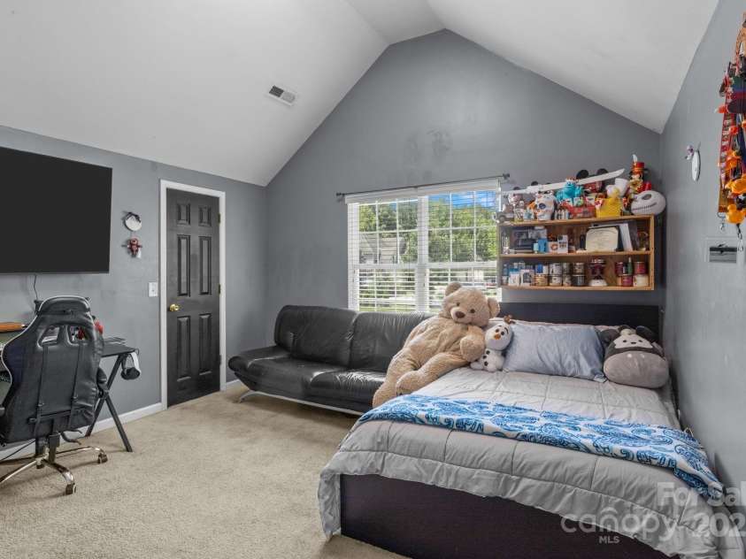 4205 Springhaven Drive, Charlotte, NC 28269.  MLS# CAR4275693, YatesRealty ID 32889. 4th bedroom shown w/ a queen size bed gives you an idea of room size!