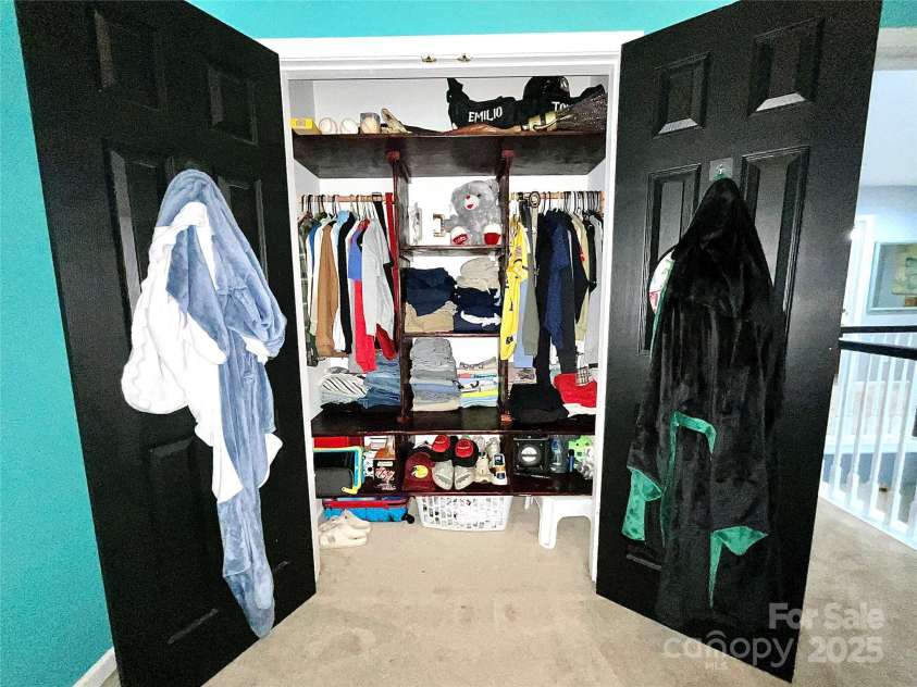 4205 Springhaven Drive, Charlotte, NC 28269.  MLS# CAR4275693, YatesRealty ID 32889. 5th bedroom also has custom built shelving to help maximize organization and storage space.