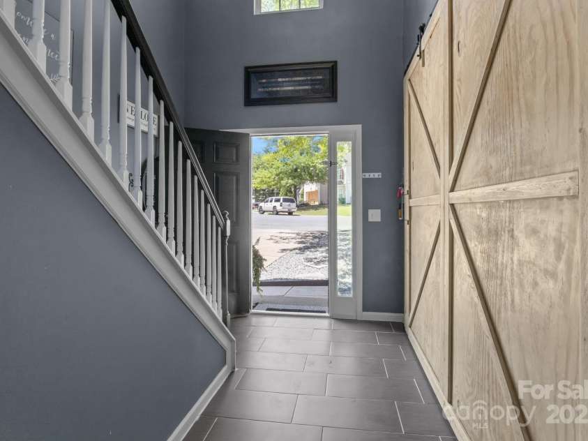 4205 Springhaven Drive, Charlotte, NC 28269.  MLS# CAR4275693, YatesRealty ID 32889. Custom built barn doors lead you into the formal Living Room which can be used as a Study.