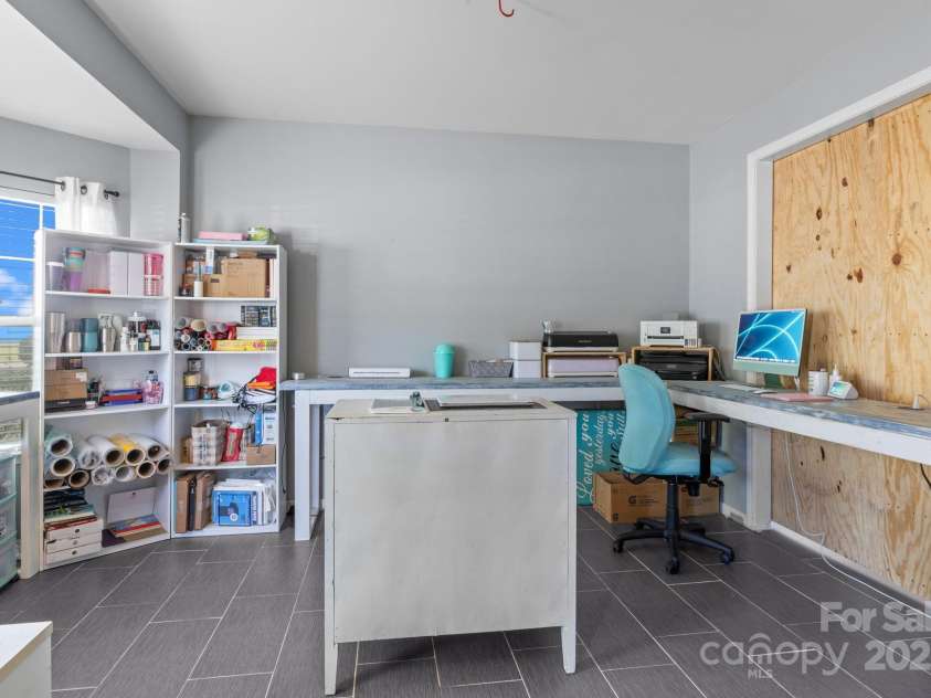 4205 Springhaven Drive, Charlotte, NC 28269.  MLS# CAR4275693, YatesRealty ID 32889. Large Living Room is currently being used for home business.