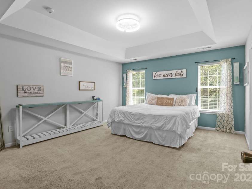4205 Springhaven Drive, Charlotte, NC 28269.  MLS# CAR4275693, YatesRealty ID 32889. Large Primary bedroom w/ tray ceiling.