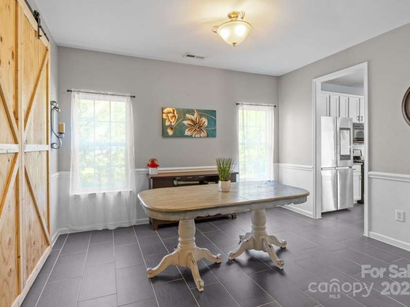 4205 Springhaven Drive, Charlotte, NC 28269.  MLS# CAR4275693, YatesRealty ID 32889. Nice size Dining room is perfect for those special diners w/ family and friends.