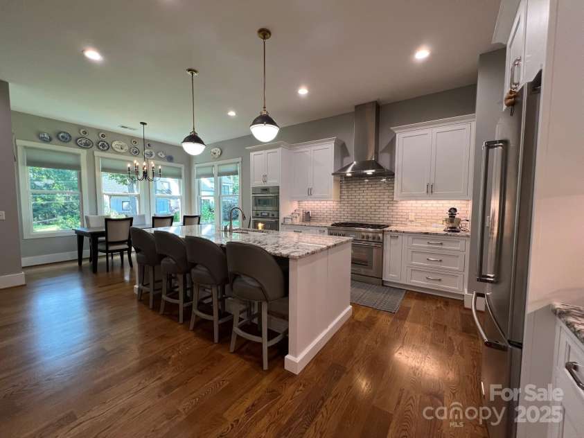 126 Redbud Lane, Troutman, NC 28166.  MLS# CAR4284135, YatesRealty ID 32890. Check out the nice pendant lighting over the island.