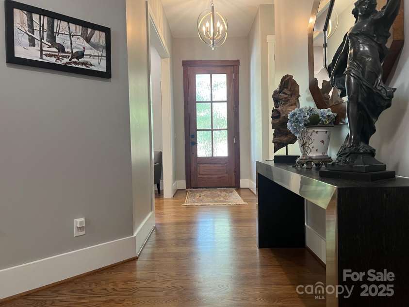 126 Redbud Lane, Troutman, NC 28166.  MLS# CAR4284135, YatesRealty ID 32890. From the covered porch, you enter the mahogany front door and step into this lovely foyer.