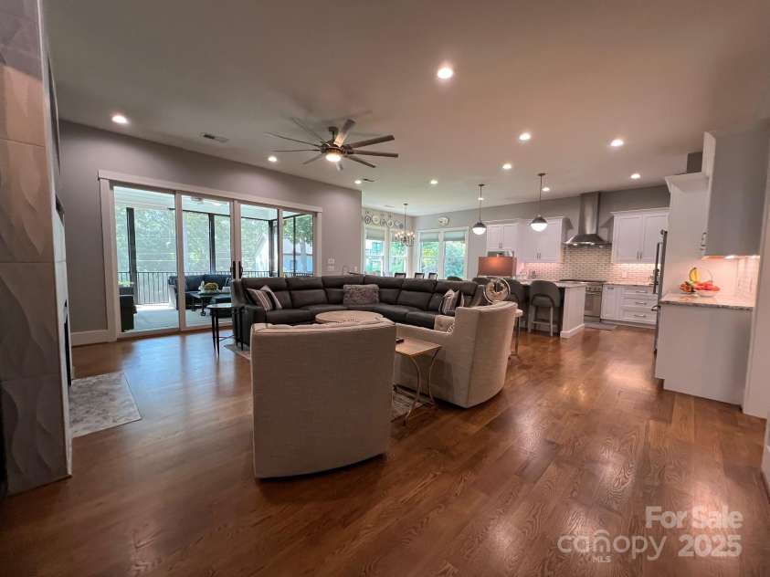 126 Redbud Lane, Troutman, NC 28166.  MLS# CAR4284135, YatesRealty ID 32890. From the foyer, you enter this huge great room that is open to all the main gathering places of the home. You will immediately notice the abundance of windows that brings in natural light and beautiful views of the back and